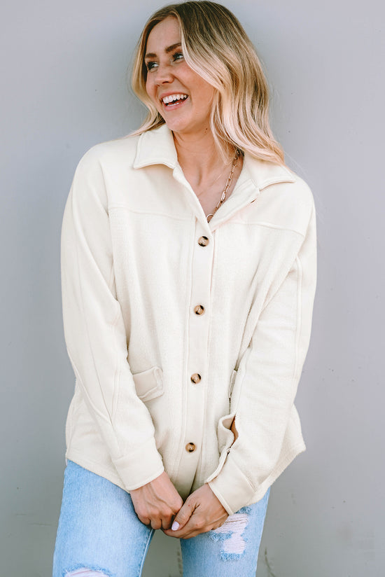 Beige buttoned jacket with pocket and raw hem