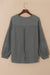 Grey waffle knit top with bubble sleeves and patchwork with exposed seams