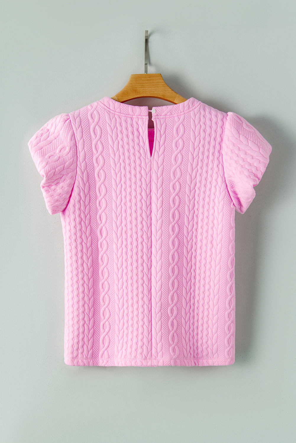 Camiseta rosa texturizada con mangas hinchadas
