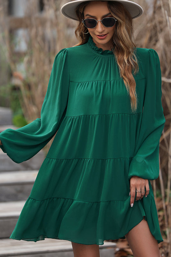 Vestido verde con volantes y mangas hinchadas *