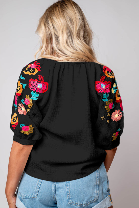 Black textured blouse with puffy sleeves and Ricrac floral embroidery