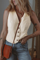 White vest buttoned with v * collar