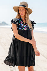 Black mini-ruffle with ruffles and ruffles with several levels embroidered with flowers