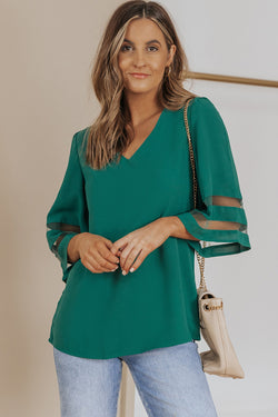 Green loose blouse with flared sleeve and v -collar