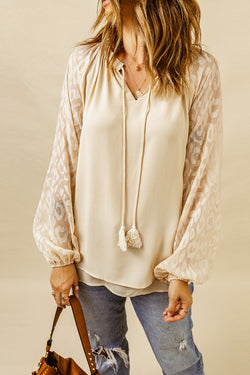 Beige blouse with split neck and puffy sleeves in leopard mesh