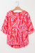 Oversize red blouse with abstract print, V-neck, bat handles