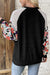 Black ribbed blouse with long sleeves and floral patchwork