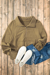 Brown sweatshirt with stand-up collar and kangaroo pocket with quarter-turn zip