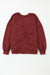 Oversize twisted sweatshirt with open back and bright red exposed seams