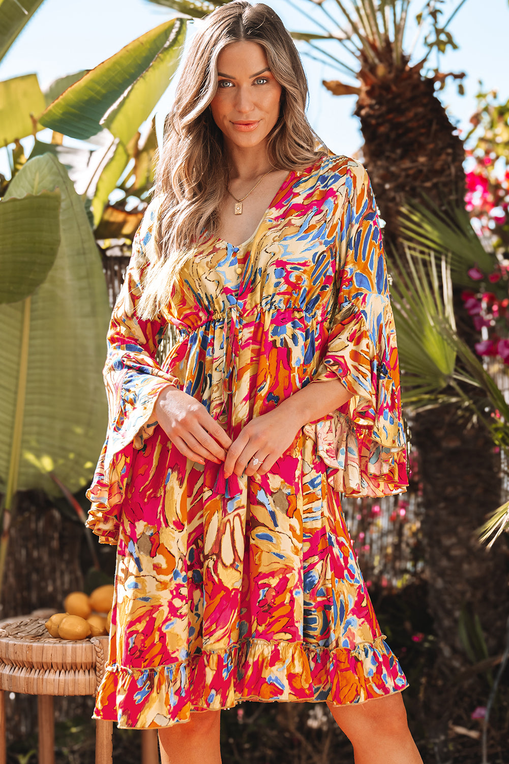 Robe fluide rose à manches évasées *