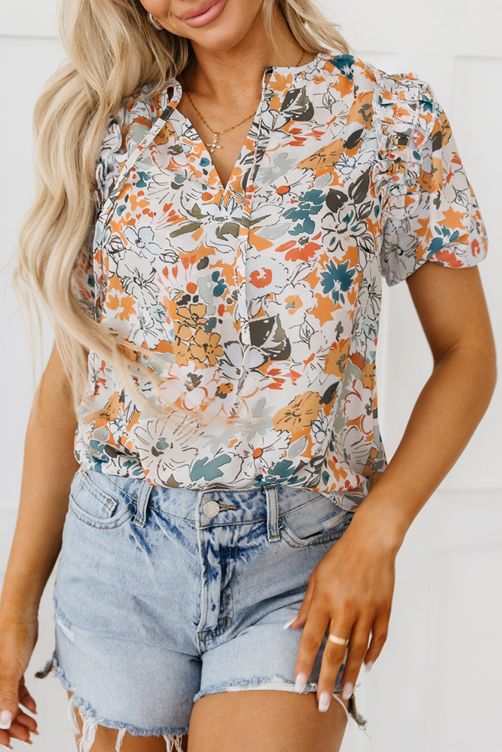 Blouse multicolore fendue à col en V et manches bouffantes à imprimé floral