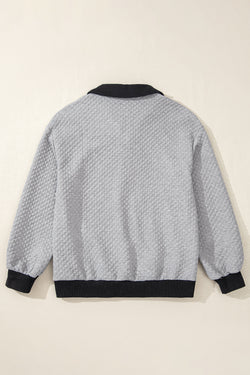 Light gray textured sweatshirt with color block edges and button-down collar