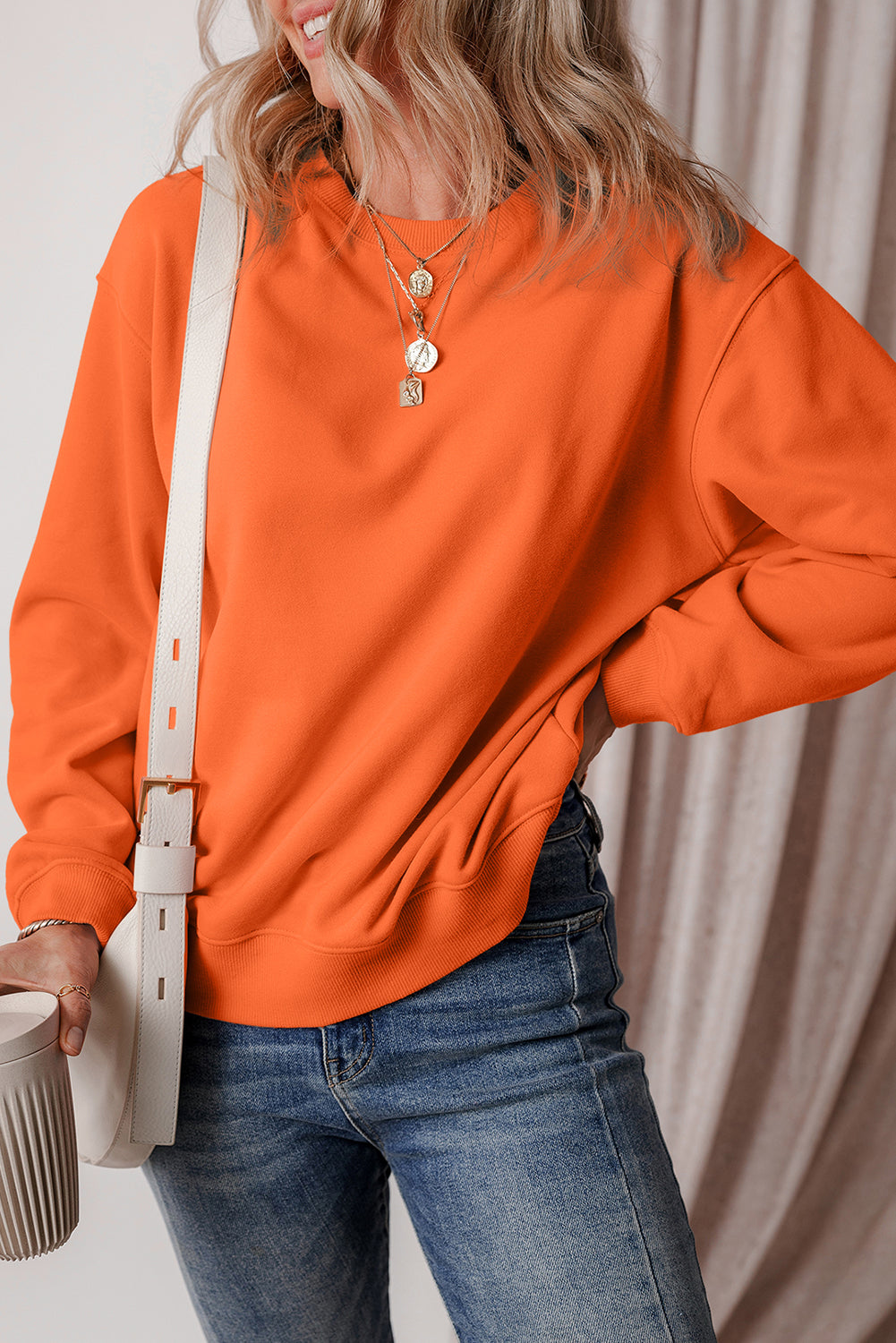 Sudadera en tela de esponja con hombros caídos y forro en united anaranjado de color rojo naranja