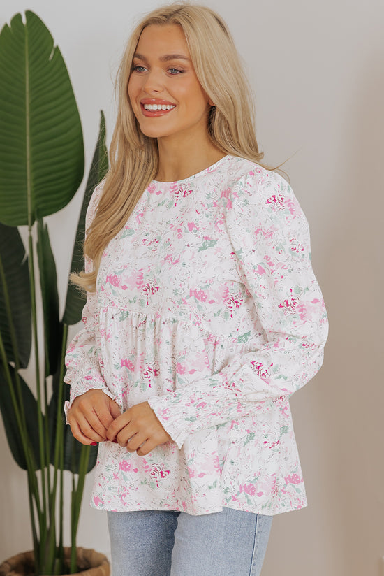 Babydoll pink blouse with floral print and frozen balloon sleeves with lock hole on the back