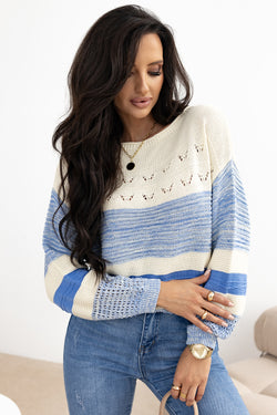 Light blue sweater with puffed sleeves and open stitch