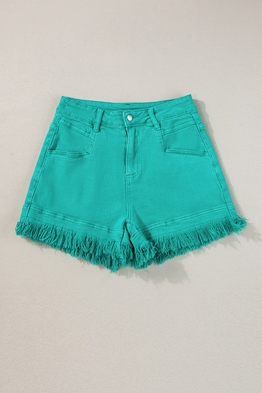 Mid-rise denim shorts with frayed edges in turquoise