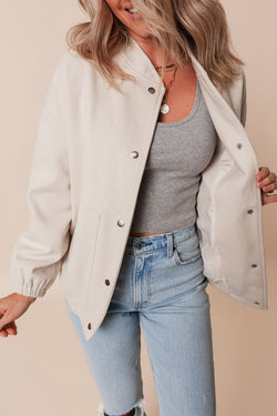 Beige bomber jacket with pockets and baseball collar