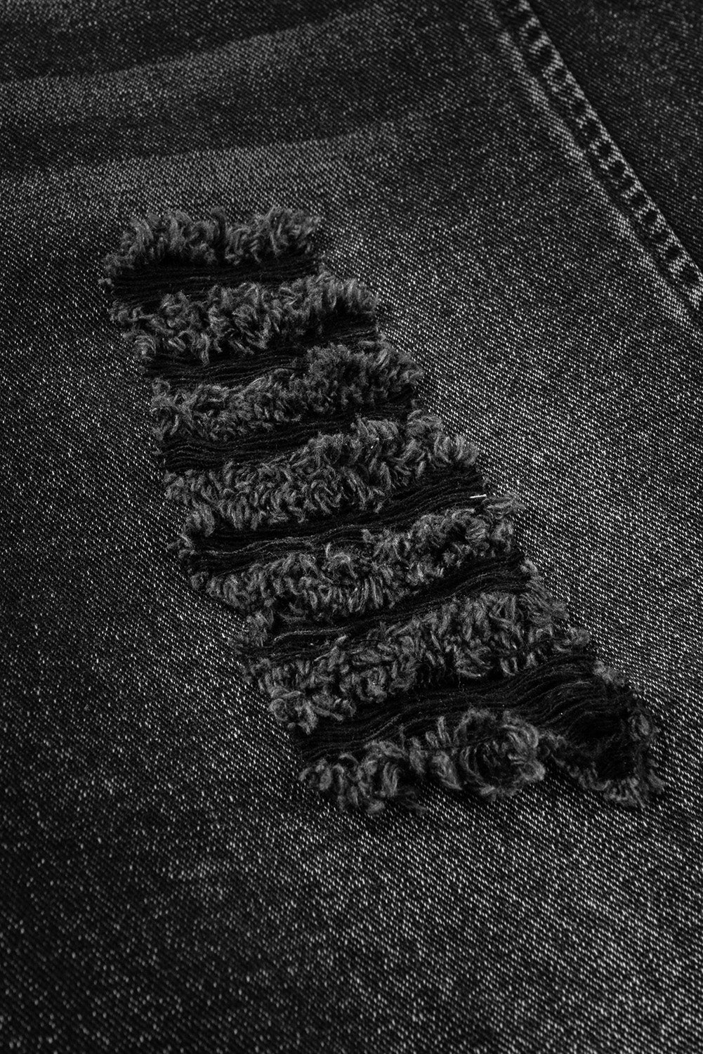 Salopette en jean noir effet vieilli avec poche à bavette et jambe large