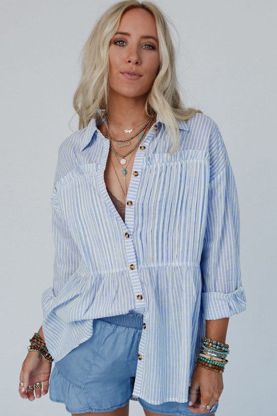 Long sleeve shirt buttoned with sky blue striped