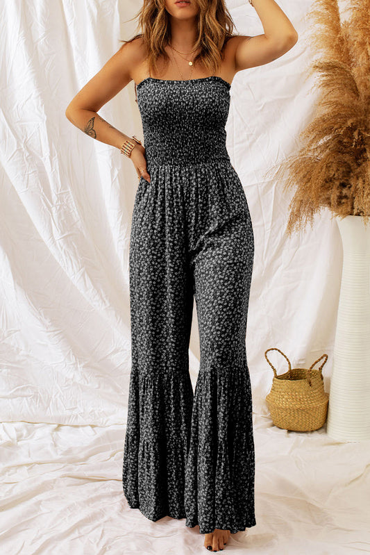 Black floral jumpsuit with thin straps and smocked bodice