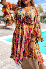 Robe fluide rose à manches évasées *