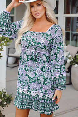 Green dress with floral print and border *