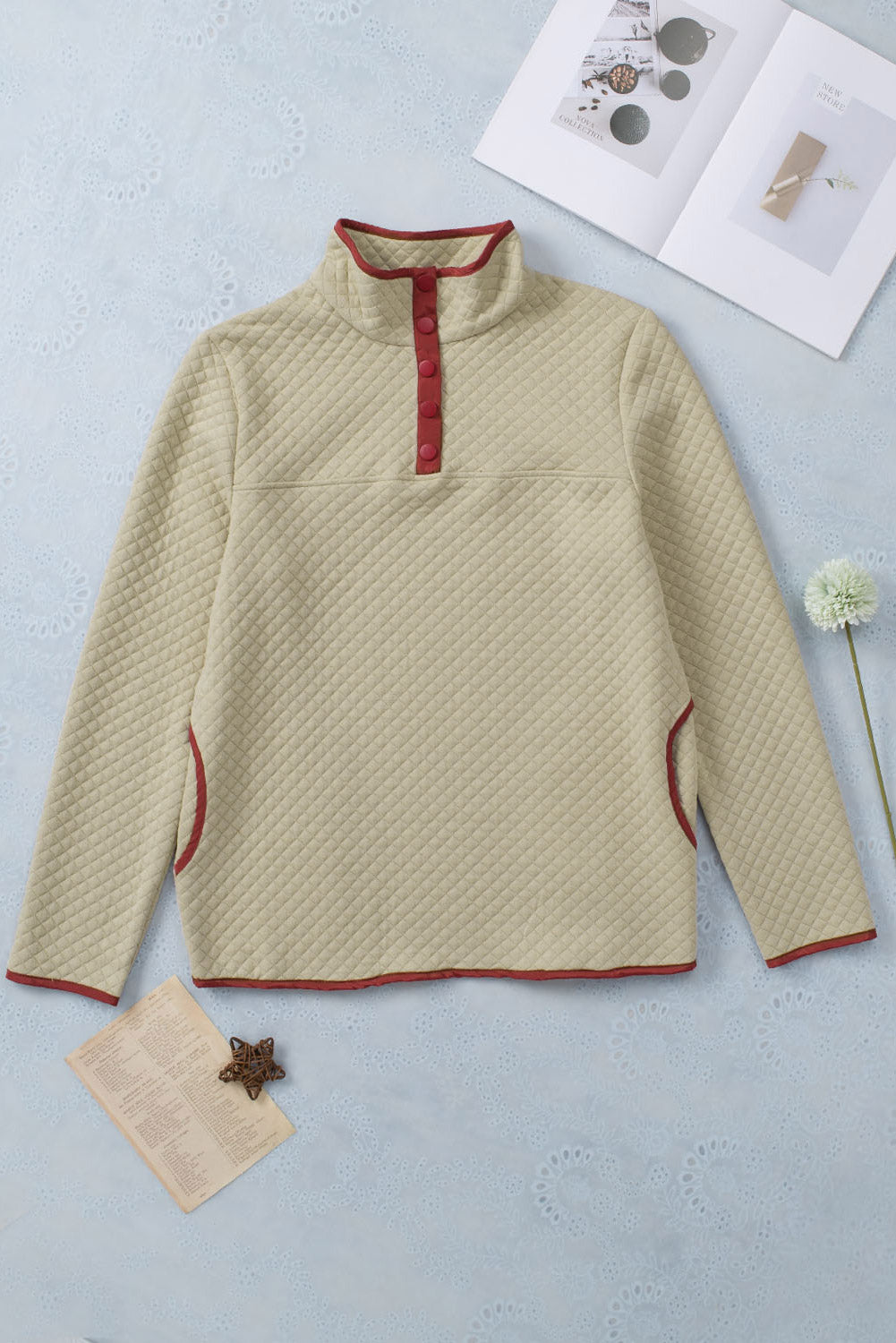 Beige geometric sweatshirt with snap buttons and contrast binding