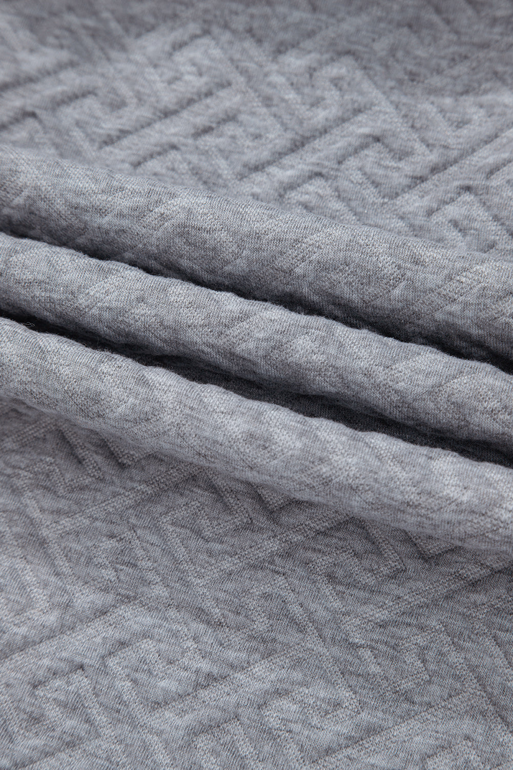 Sudadera gris con media fera éclair textúe uni