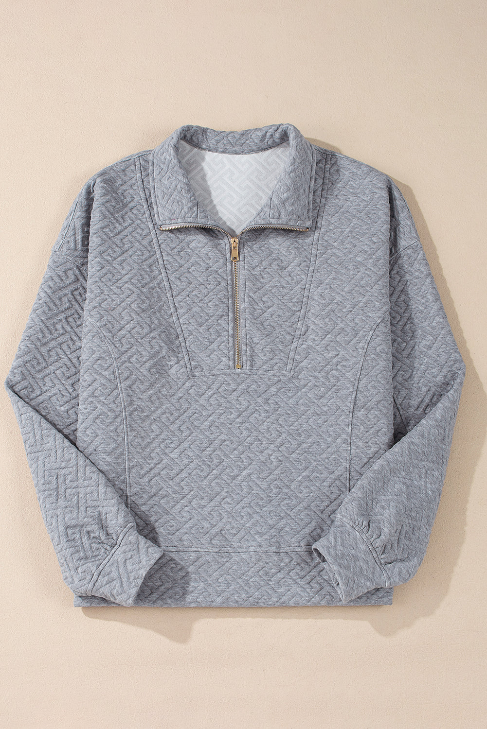 Sudadera gris con media fera éclair textúe uni