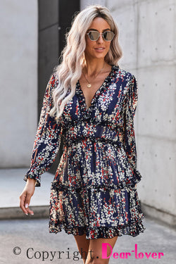 Blue floral dress with ruffles and open back