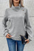 Grey textured sweatshirt with mock neck and asymmetrical buttons