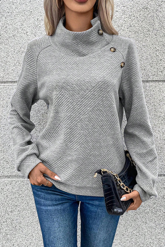 Grey textured sweatshirt with mock neck and asymmetrical buttons