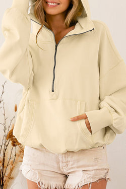 Beige zip-up hoodie with kangaroo pocket and ribbed trim