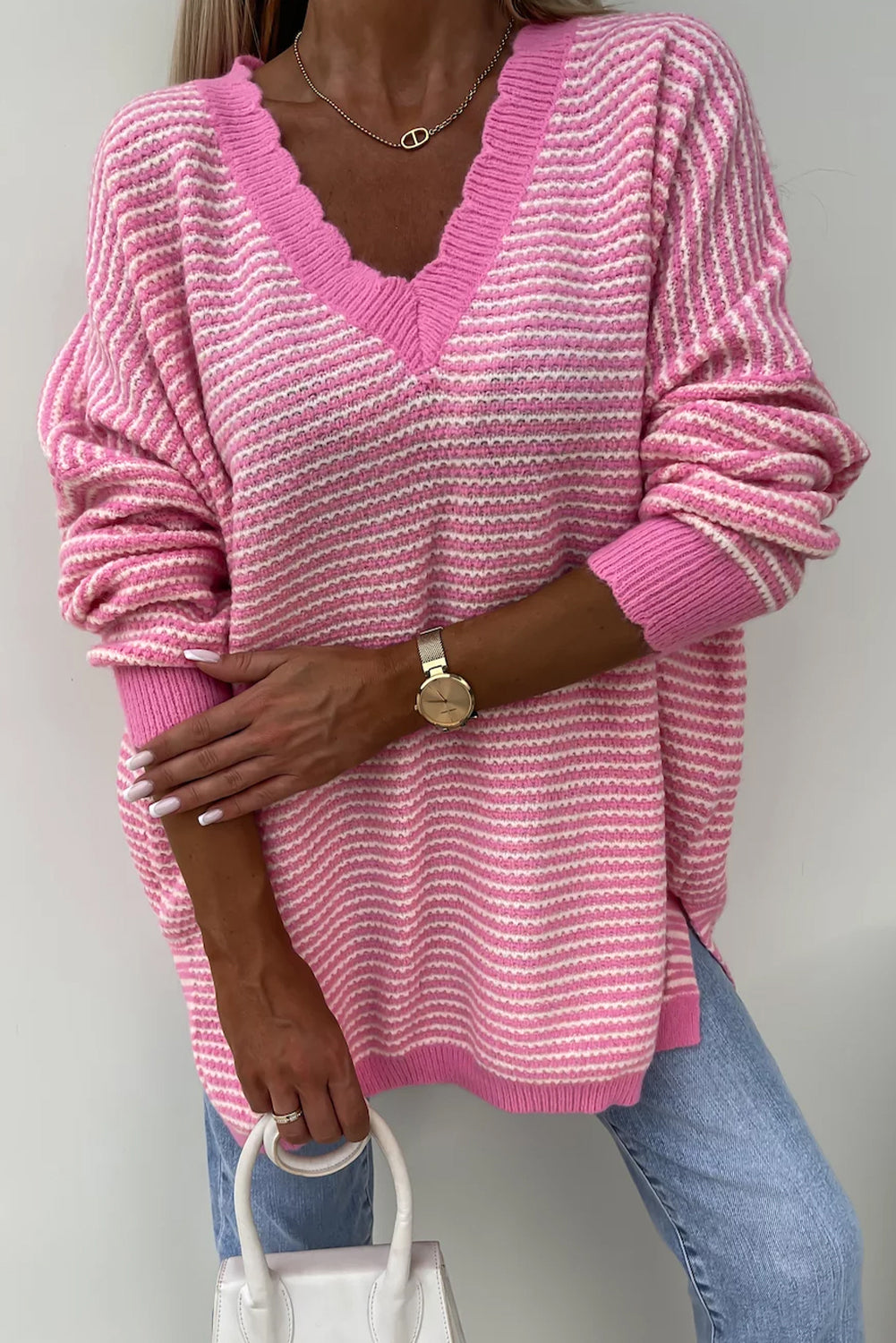 Loose V-neck sweater with pink striped slits