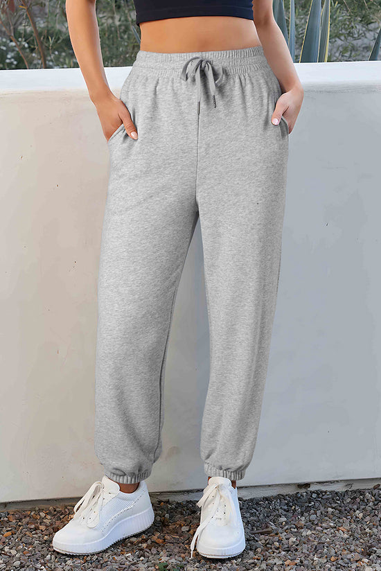 Pantalon de jogging gris clair à la taille avec cordon de serrage et doublure en polaire de couleur unie