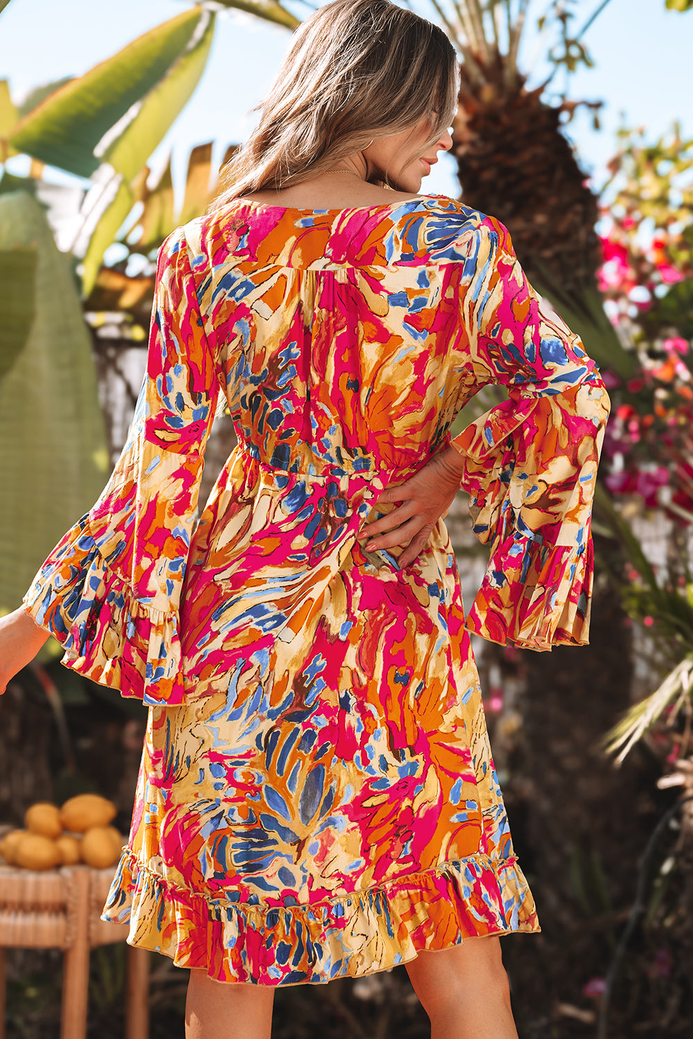 Robe fluide rose à manches évasées *