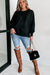 Black sweatshirt with exposed seams, dropped shoulders, round neck, slits