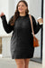 Large black sweater dress in twisted knitted with drooping shoulders