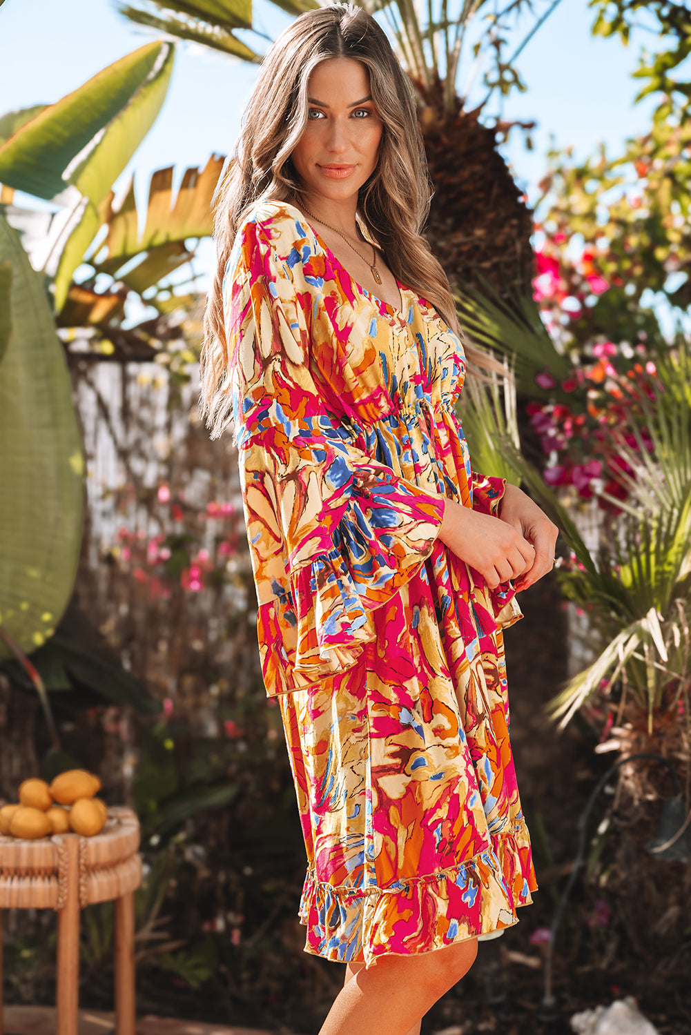 Robe fluide rose à manches évasées *