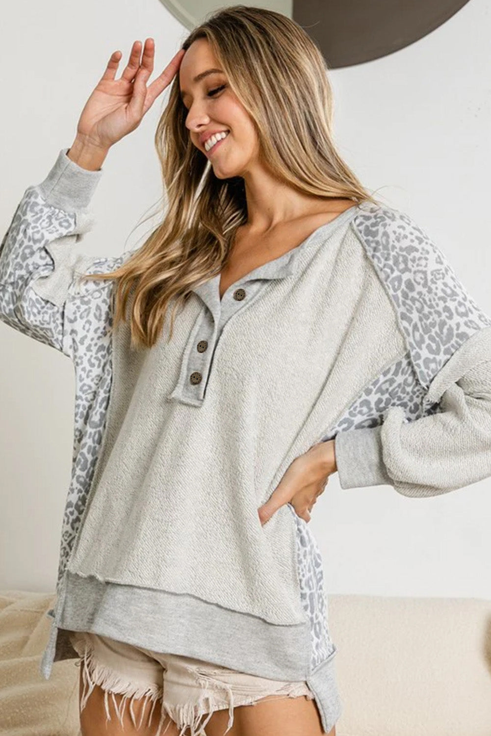 Gray Sweatshirt with buttoned collar and exposed seams in leopard patchwork