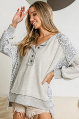 Gray Sweatshirt with buttoned collar and exposed seams in leopard patchwork
