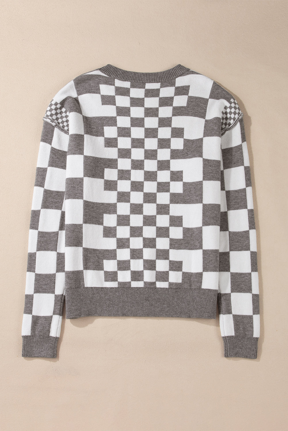 Pull gris à carreaux et épaules tombantes, col rond