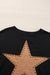 Black oversized high with long sleeves and studded star pattern