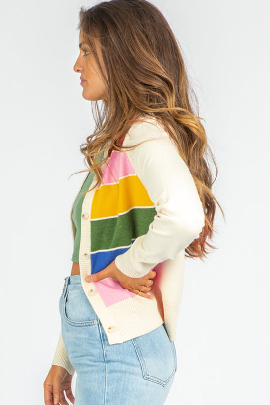 Cardigan with white striped and colored patterns, buttoned on the front