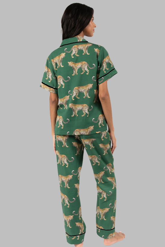 Green pajama set with short sleeve shirt and cheetah print pants