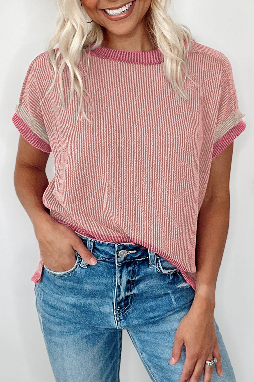 Light pink t-shirt with round neck and contrasting textured border