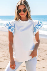 White blouse embroidered with fluffy sleeves and ruffle collar