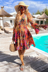 Robe fluide rose à manches évasées *