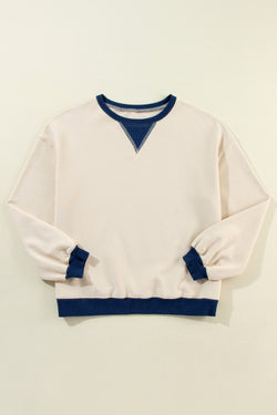 White oversized sweatshirt with dropped shoulders and color block patch