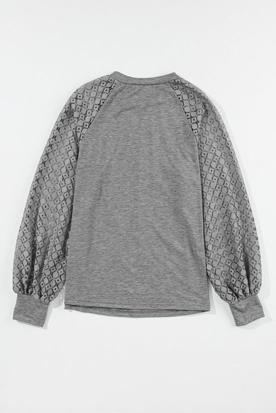 Grey pleated knit top with raglan sleeves and contrast lace